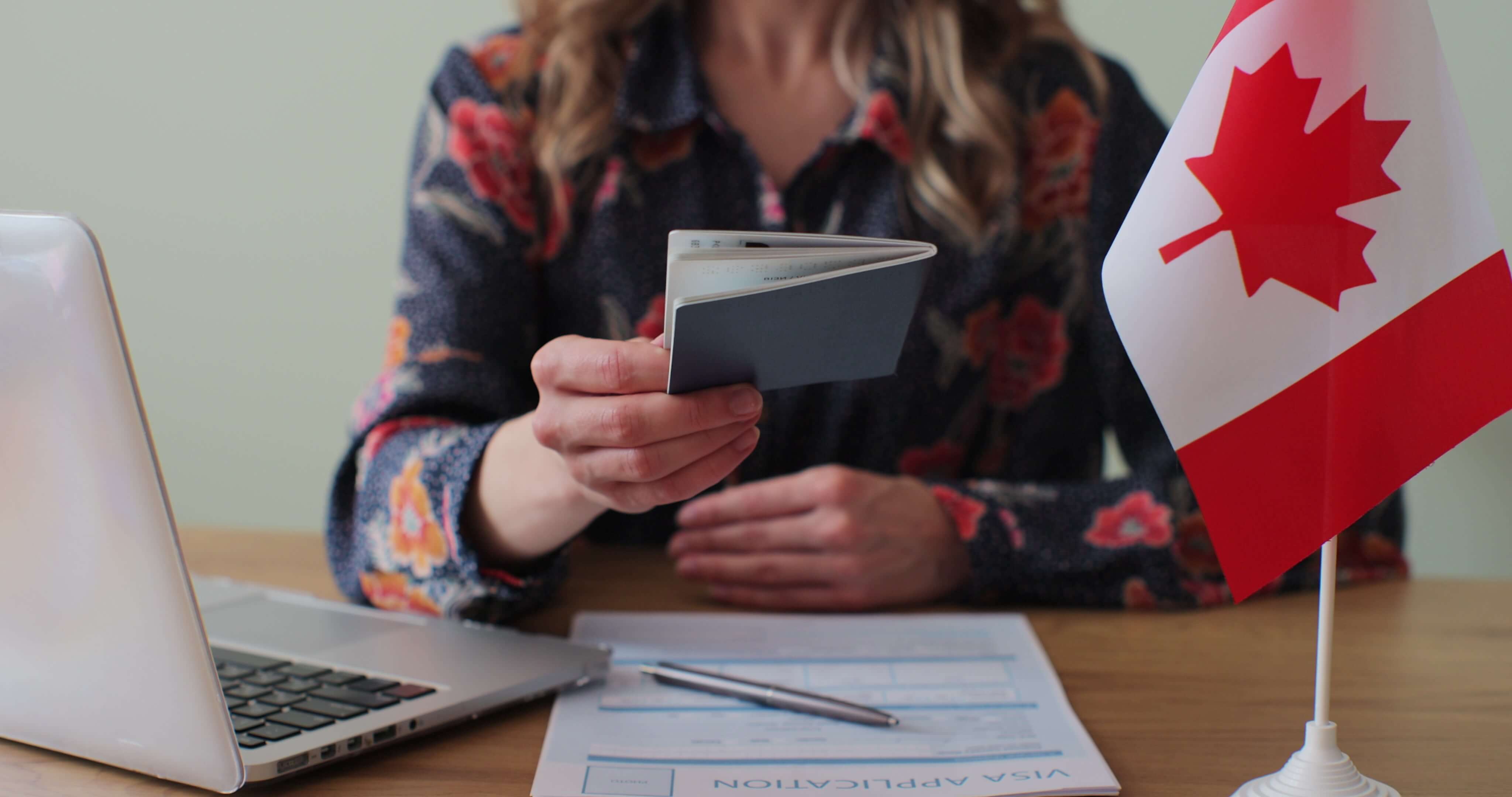canadian-woman-consular-officer-giving-passport-male-immigrant-work-visa-citizenship-visa-application-online-form-immigration-concept-visa-approval
